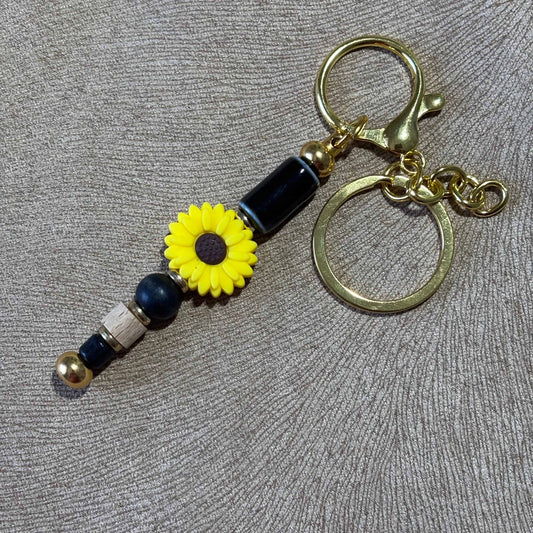 Porte clé en perles motif perles et fleur jaune