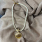 Collier fantaisie |Corde nylon écrue pendentif coquillage doré