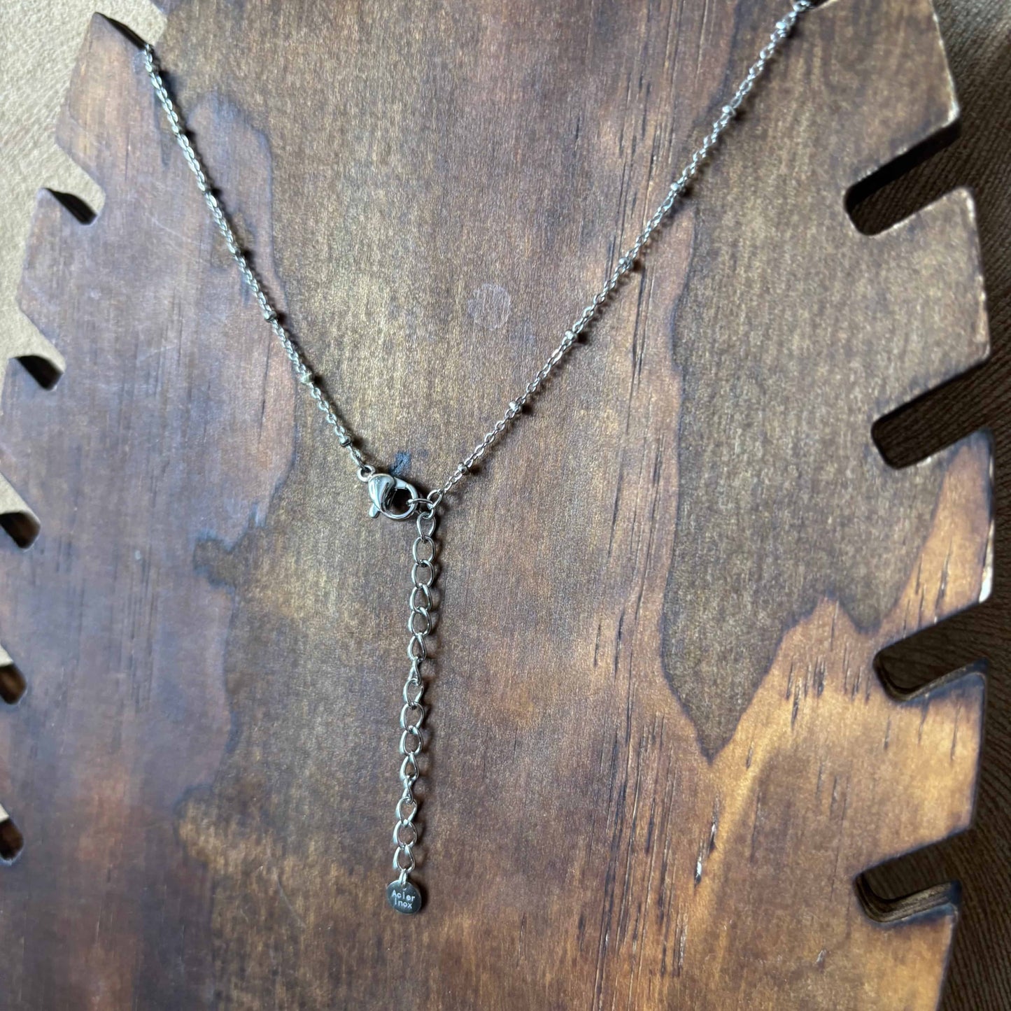 Collier argenté | Breloques fleurs lune étoile et soleil vue de l'arrière| Acier inoxydable