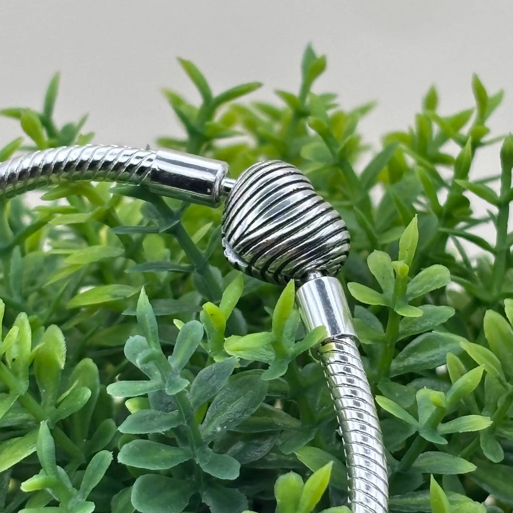 Un bracelet Pand'Or avec charm en forme de cœur  en acier inoxydable