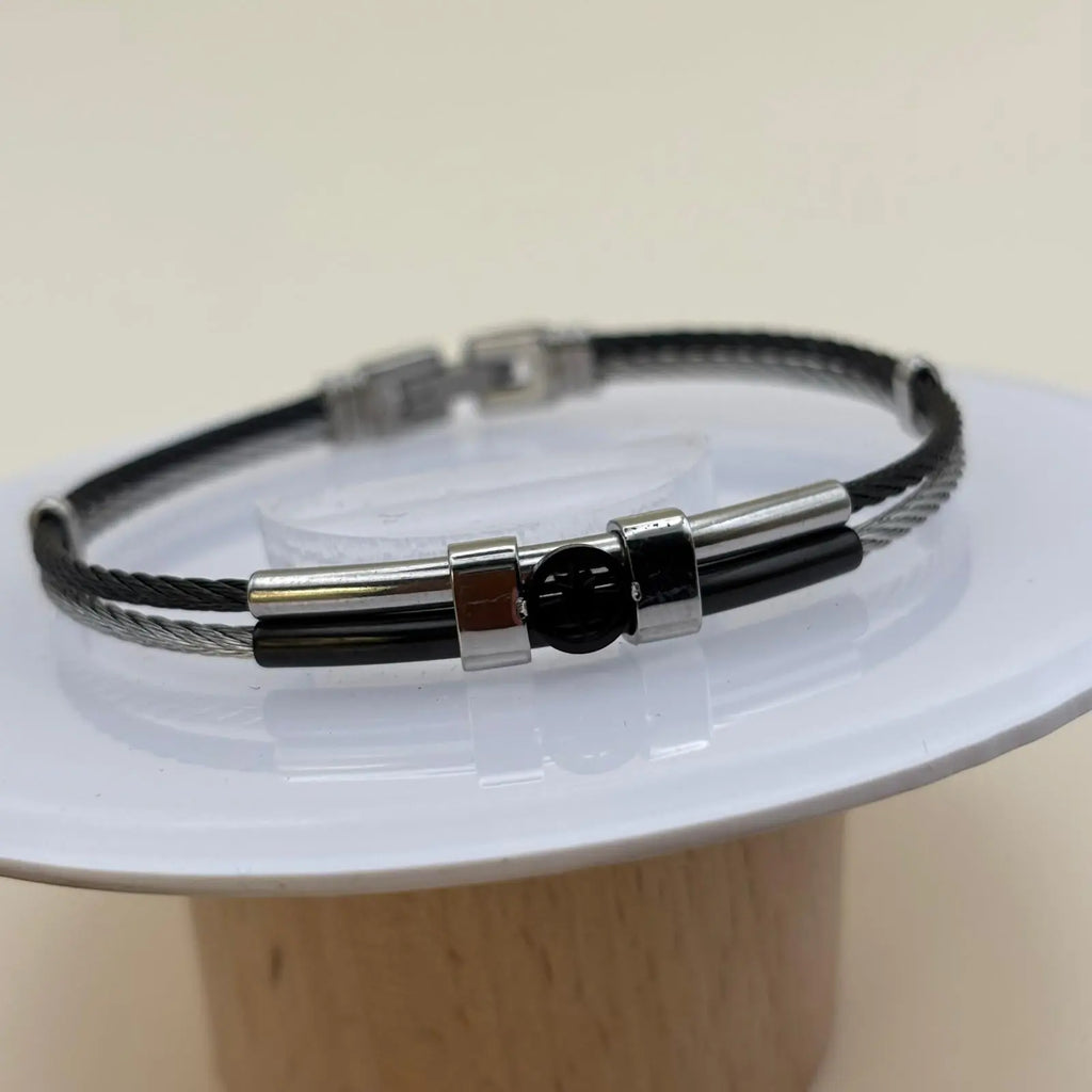 Bracelet argenté pour homme avec  un motif câble tressé noir en acier inoxydable détail central rose des vents