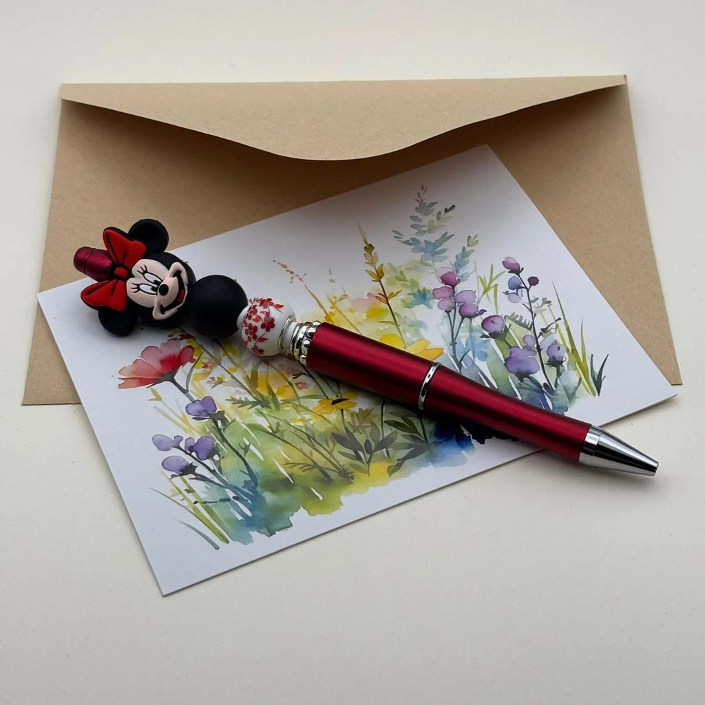 Stylo à bille noir avec mine rétractable breloque minnie perle noire et porcelaine