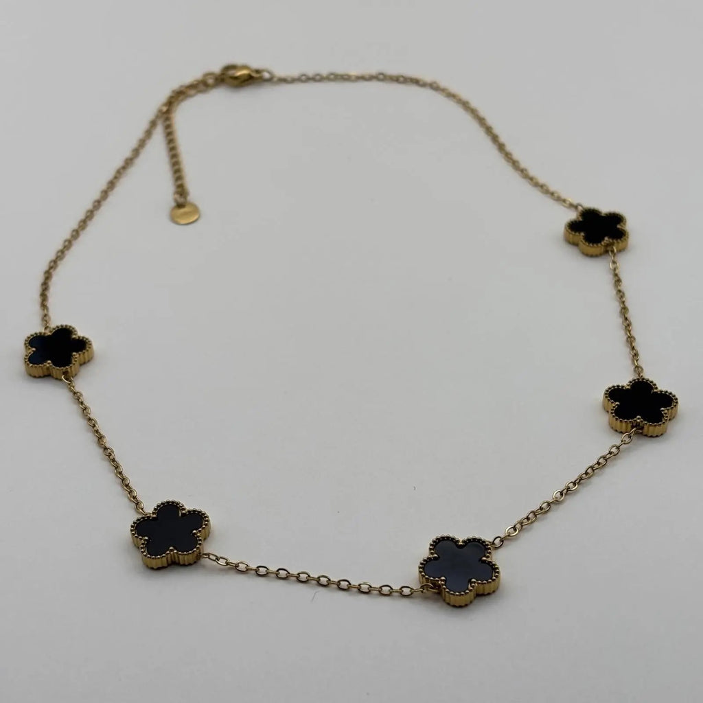 Collier doré avec de fins maillons et des fleurs colorées noires en acier inoxydable