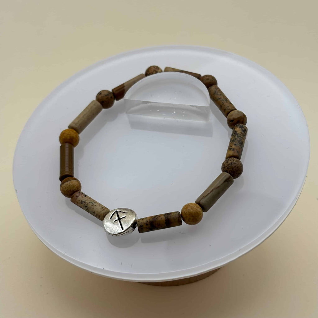 Bracelet en perles sur élastique avec perles en porcelaine et en verre et médaillon avec le signe du sagittaire