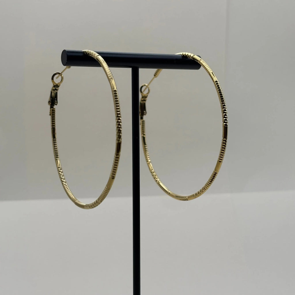 Boucles d'oreilles créoles avec anneau doré