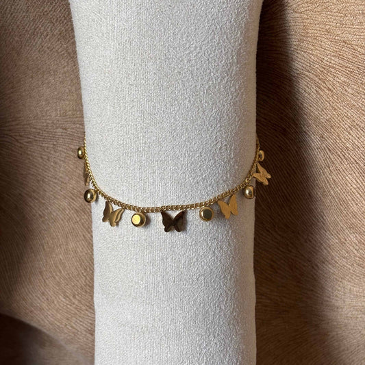 Bracelet de cheville
Chainette dorée
Breloques papillons et brillants