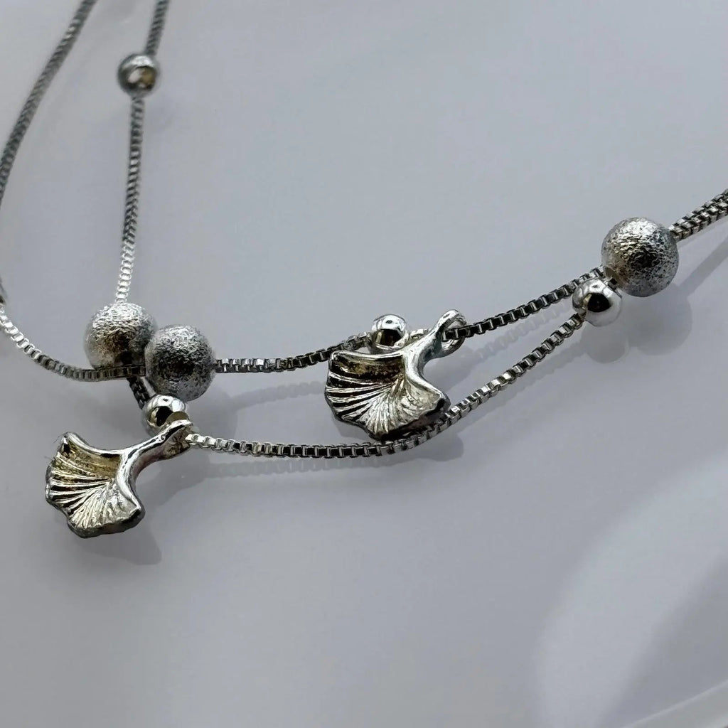 Bracelet de cheville et des breloques en  forme de feuilles et de perles