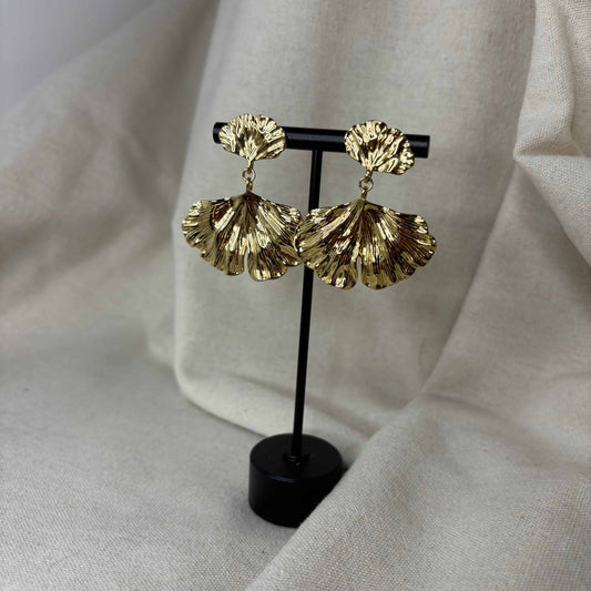 Boucles d'oreilles pendentif avec motif de feuille or en acier inoxydable vendues sur le site internet prêtes à briller