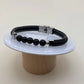 Bracelet homme avec un bracelet noir en simili cuir avec des perles noires 