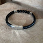 Bracelet homme | Sur lien tressé noir en simili cuir |5 perles noires | En acier inoxydable