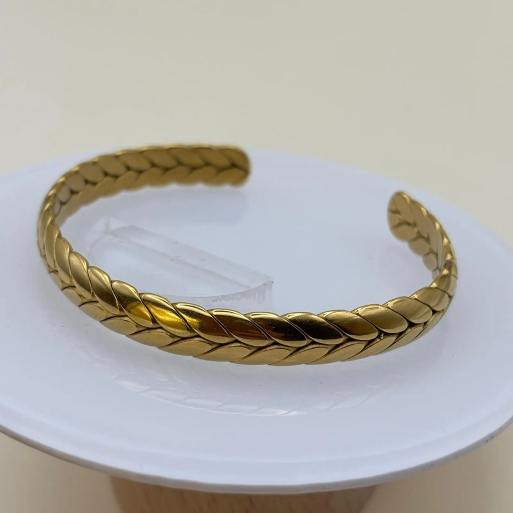 Bracelet jonc ouvert doré avec des motifs couronne de laurier