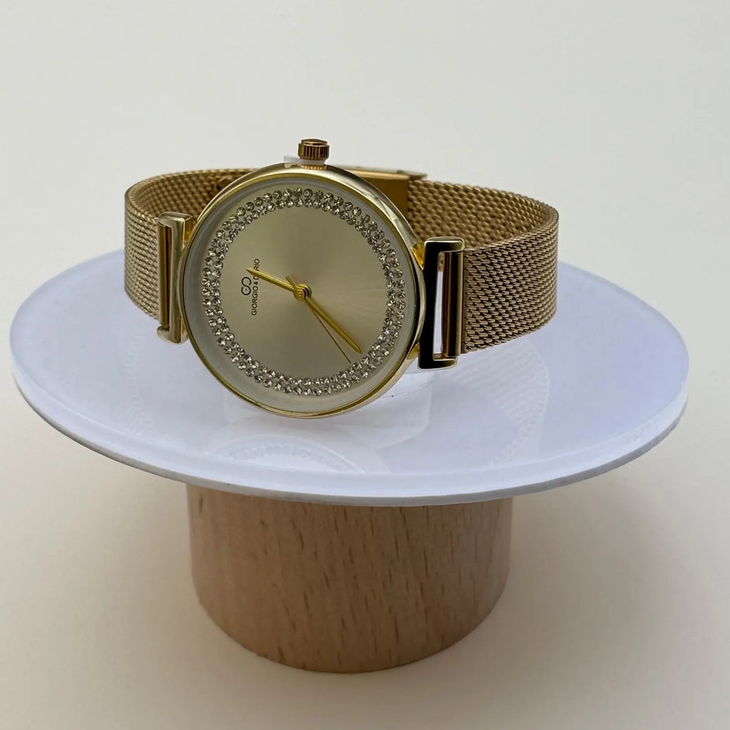 Montre pour femme bracelet doré cadran blanc irisé orné de strass