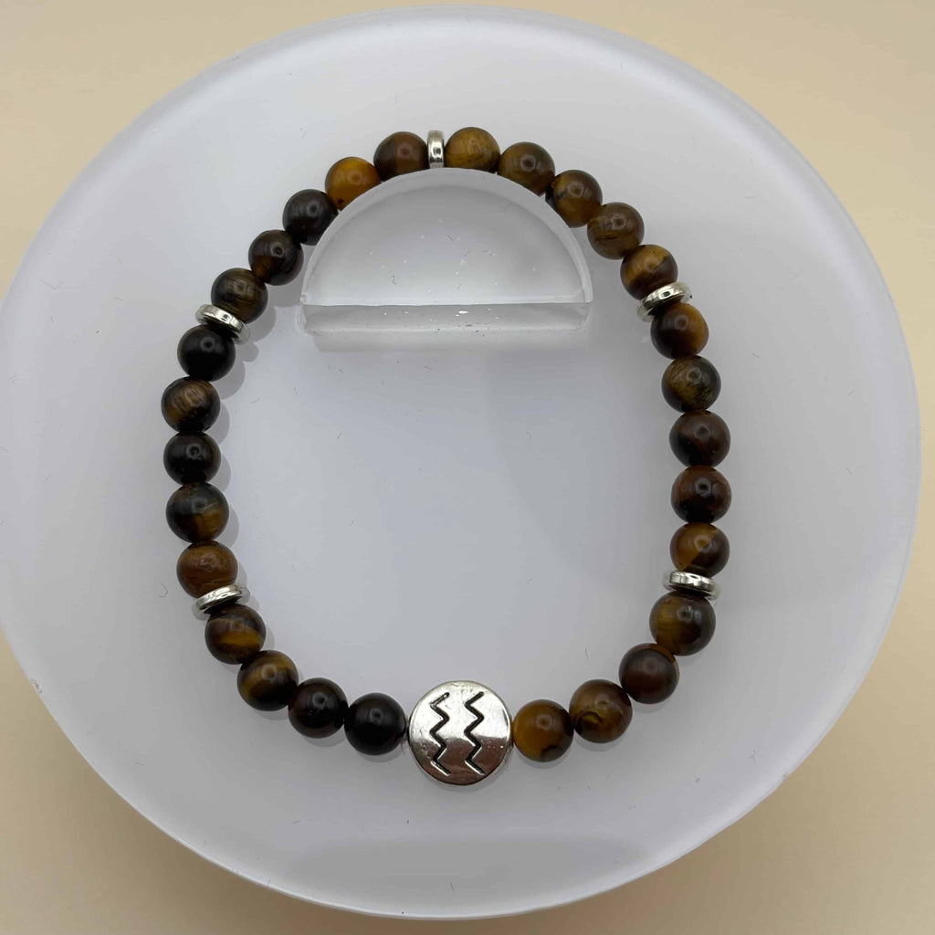 Bracelet en perles sur élastique avec perles en porcelaine et en verre et médaillon avec le signe zodiacal du verseau