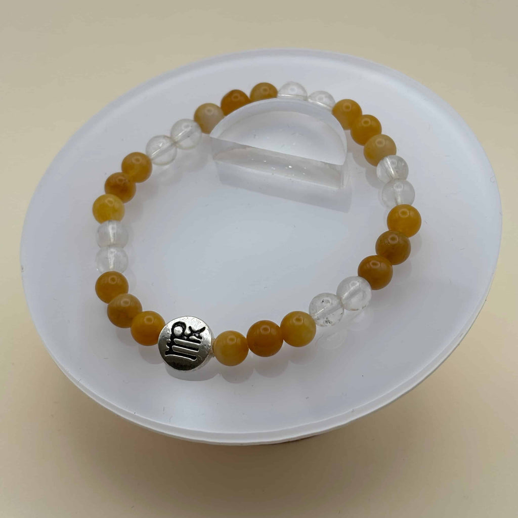 Bracelet en perles sur élastique avec perles en porcelaine et en verre et médaillon avec le signe  de la vierge