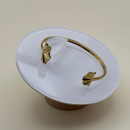 Bracelet doré rigide avec motifs feuille en acier inoxydable